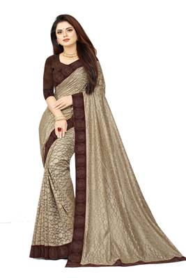 Beige embroidered net saree with blouse 1