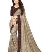 Beige embroidered net saree with blouse