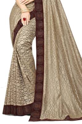 Beige embroidered net saree with blouse 2