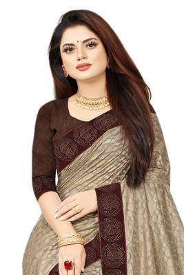 Beige embroidered net saree with blouse 3