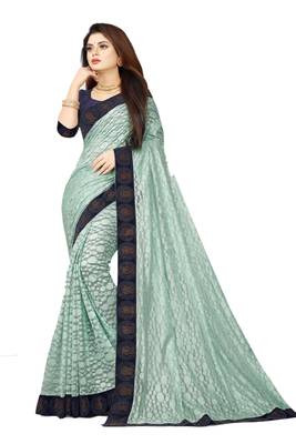 Sea green embroidered net saree with blouse 1