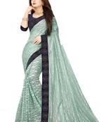 Sea green embroidered net saree with blouse