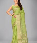 Light green woven silk saree with blouse