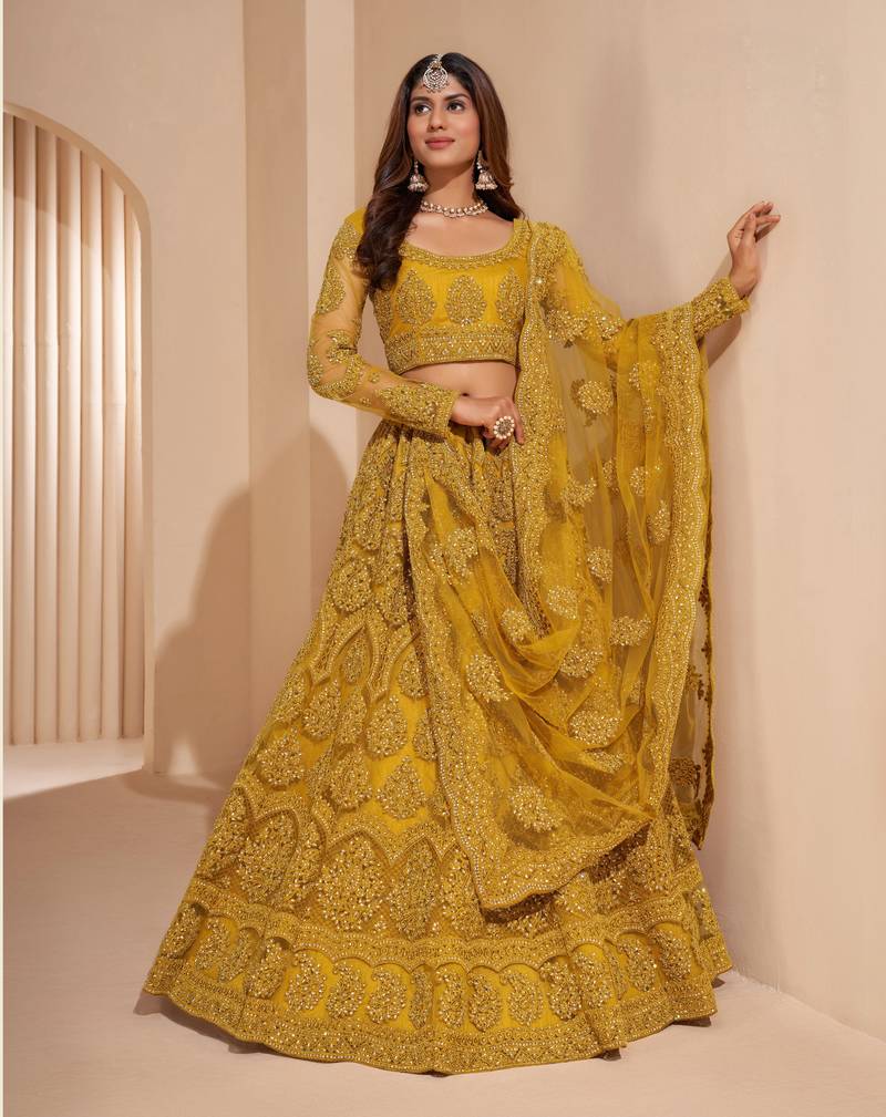 Mustard thread embroidery net semi stitched lehenga