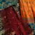 Fetching Yellow, Red and Green Colored Zari & Sequins Embroidered Taffeta Silk Semi Stitched Wedding Lehenga