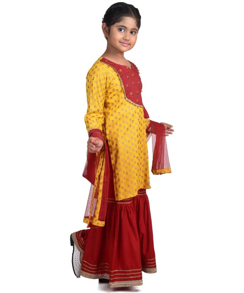 Yellow Floral Printed  Kurti with embroidered yoke work and Red Sharara and dupatta