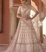 Beauteous Peach thread embroidered with zarkan crepe Silk Wedding Lehenga