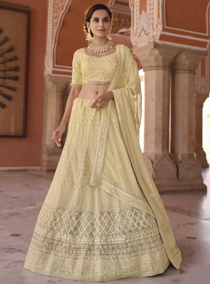 Light-yellow sequins and thread embroidered with foil mirror work georgette semi stitched designer lehenga