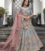 Mesmerizing Turquoise zarkan, thread, zari, dori, and sequins embroidered velvet Bridal Lehenga choli
