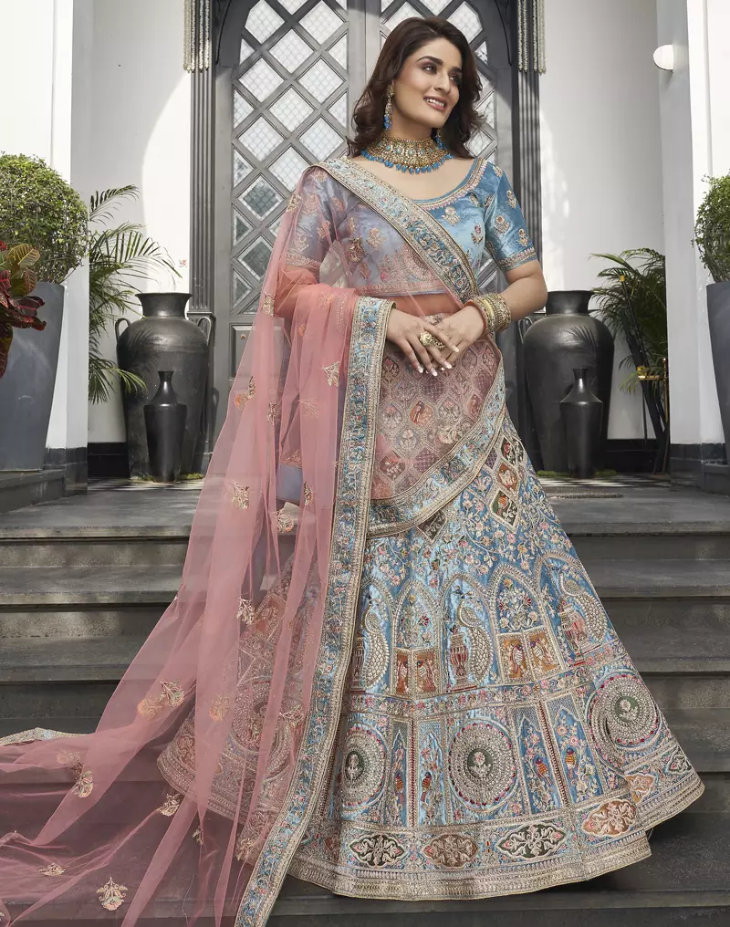 Turquoise zarkan, thread, zari, dori, and sequins embroideredvelvet semi stitched lehenga