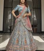 Irresistible Turquoise zarkan, thread, zari, dori, and sequins embroidered velvet Semi Stitched Lehenga