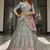 Turquoise zarkan, thread, zari, dori, and sequins embroidered velvet semi stitched lehenga