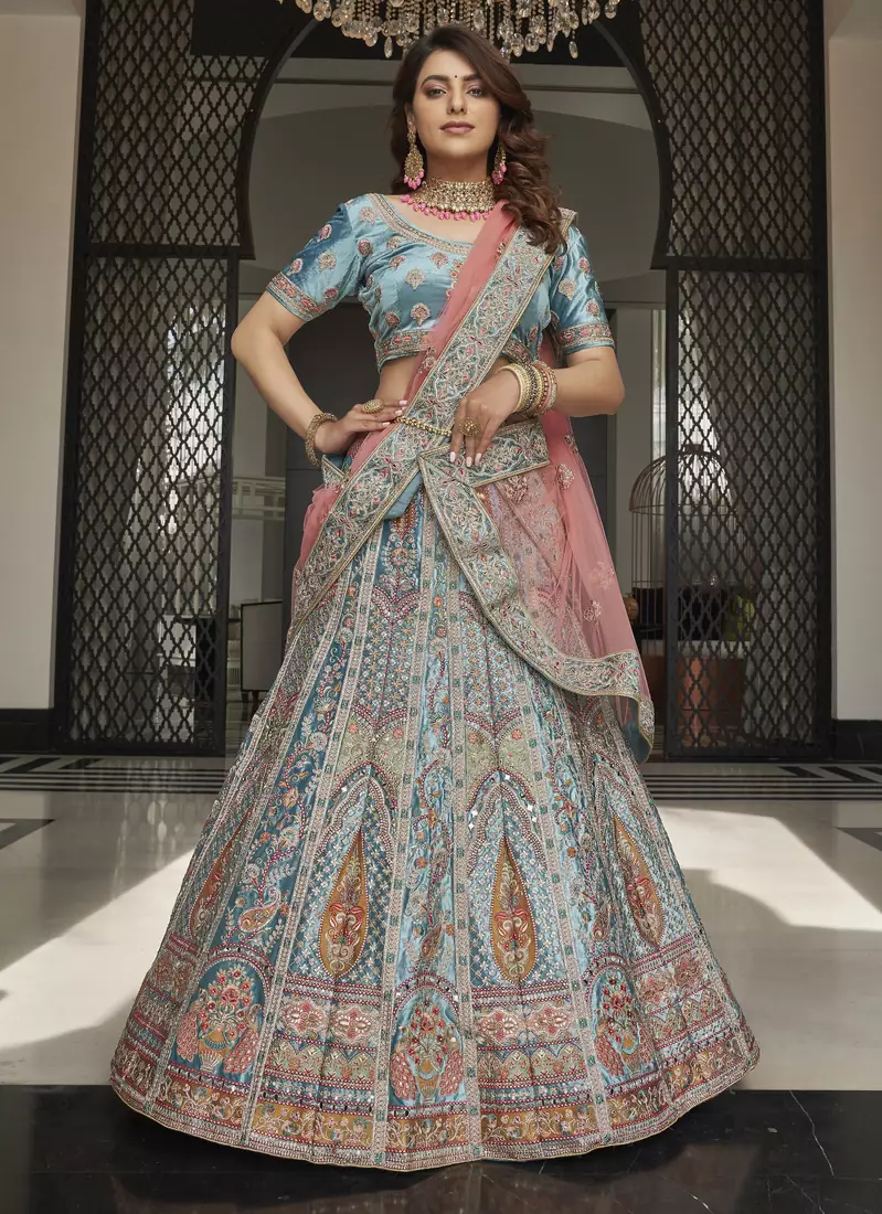 Turquoise zarkan, thread, zari, dori, and sequins embroidered velvet semi stitched lehenga