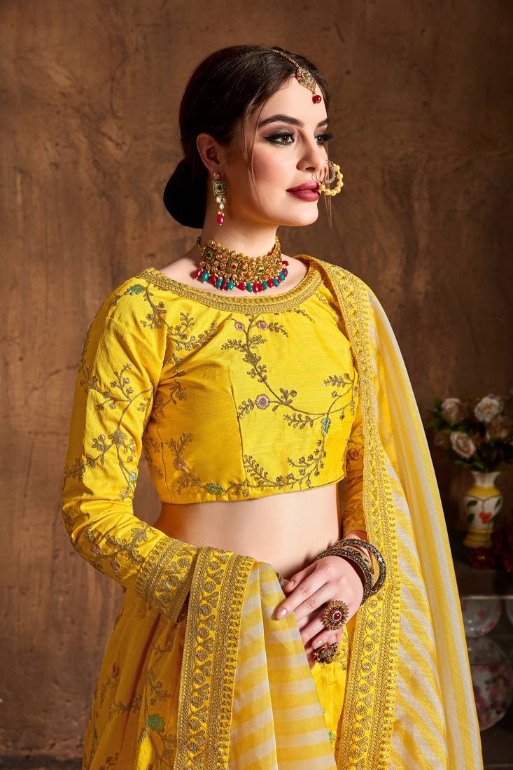 Prepossessing Yellow Dori, Zari, Thread and Glitter Sequins Embroidered Mulbury Silk Semi Stitched wedding Lehenga