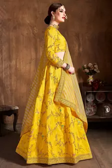 Prepossessing Yellow Dori, Zari, Thread and Glitter Sequins Embroidered Mulbury Silk Semi Stitched wedding Lehenga