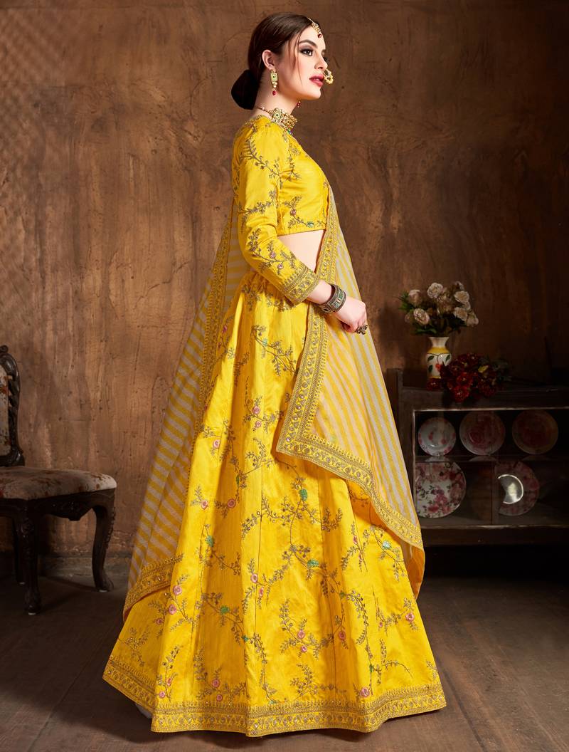 Prepossessing Yellow Dori, Zari, Thread and Glitter Sequins Embroidered Mulbury Silk Semi Stitched wedding Lehenga