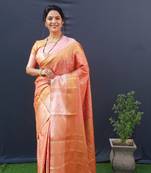 Peach woven kanchipuram silk saree with blouse