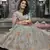 Turquoise zarkan, thread, zari, dori, and sequins embroideredvelvet semi stitched lehenga