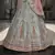 Turquoise zarkan, thread, zari, dori, and sequins embroidered velvet semi stitched lehenga