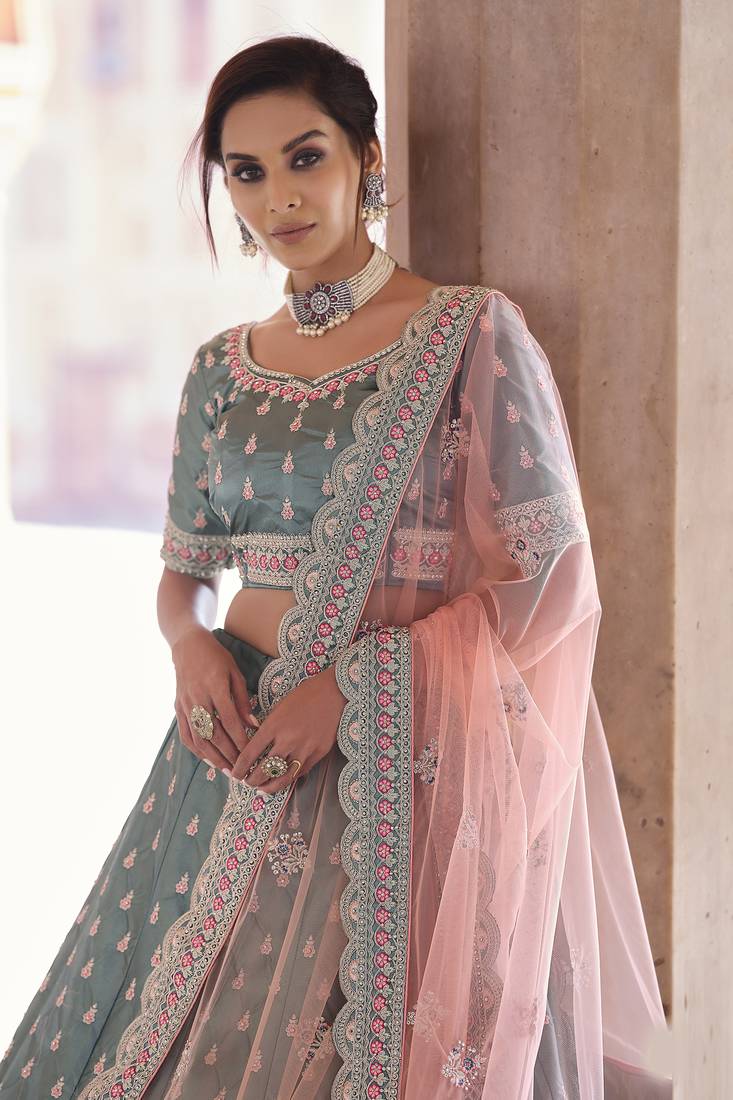 Desirable Rama Green Zarkan, Dori, and Thread embroidered satin Bridal Lehenga