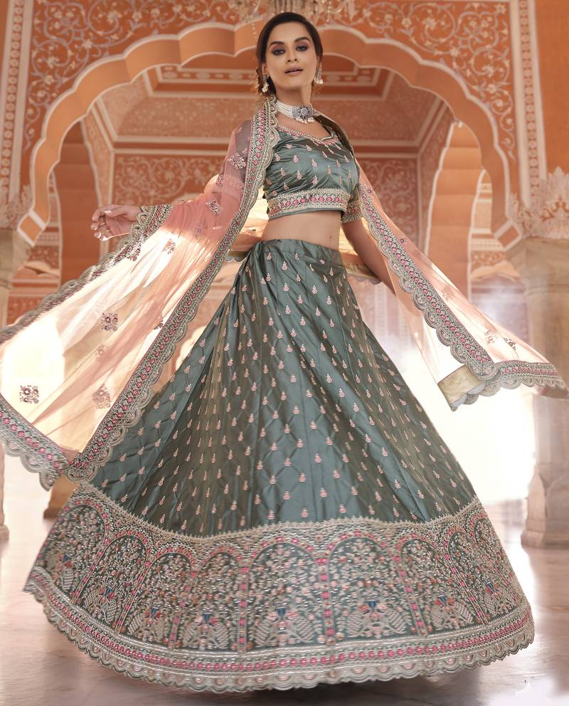 Desirable Rama Green Zarkan, Dori, and Thread embroidered satin Bridal Lehenga