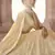 Light-yellow sequins and thread embroidered with foil mirror work georgette semi stitched designer lehenga