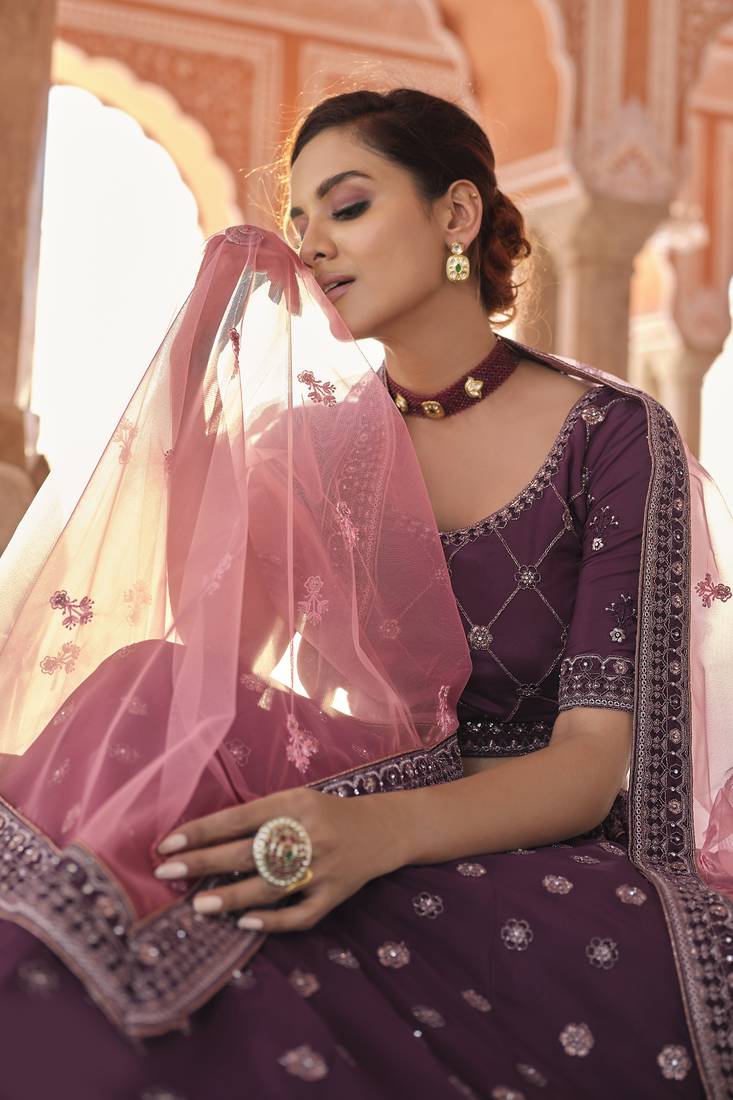 Hypnotizing Wine dori and thread embroidered with zarkan crepe designer Lehenga choli