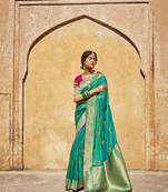 Green woven silk saree with blouse