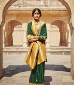 Dark green woven silk saree with blouse