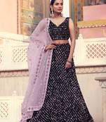 Charming black color lehenga choli with pink dupatta