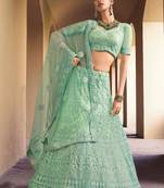 super cool sea green colored soft net base stylish lehenga choli