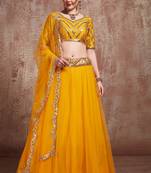Elegant Yellow colored Soft Net Base umbrella style Lehenga Choli