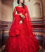 Magnificent red colored soft net base lehenga choli