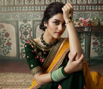 yellow premium embroidered fancy fabric traditional saree with un-stitched blouse fabric 2