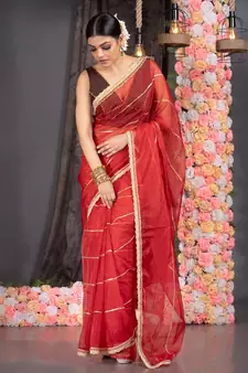 red organza saree with gota work and scallop border