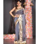 steel grey organza saree with gold gota border and  fringe lace