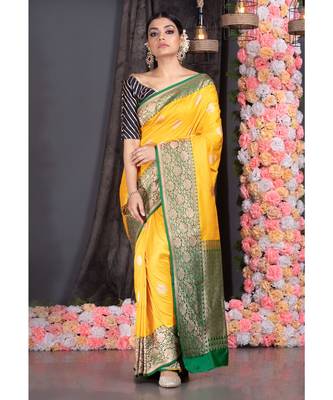yellow pure katan silk saree with green and golden border pallu 1
