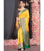 yellow pure katan silk saree with green and golden border pallu