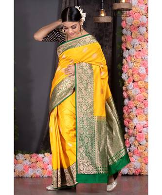 yellow pure katan silk saree with green and golden border pallu 2