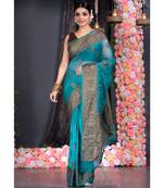 dark teal silk organza saree with antique zari border pallu