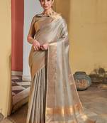 Peach woven tussar silk saree with blouse