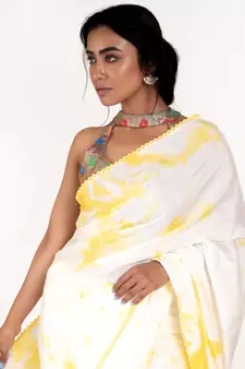 white and yellow tie and dye habutai silk blend saree with cotton lace border