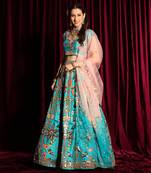 Turquoise Heavy Embroidered Lehenga Blouse With A Dupatta