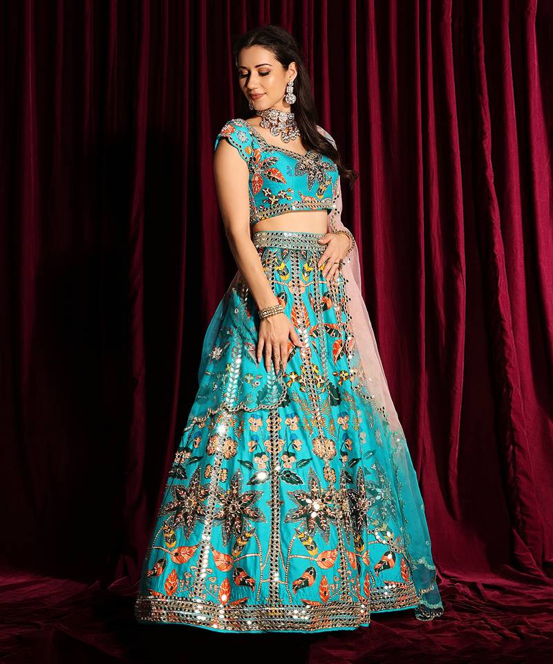 Turquoise Heavy Embroidered Lehenga Blouse With A Dupatta