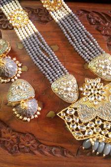 Gold designer floral meenakari kundan studed onyx stone multilayer necklace set with earrings