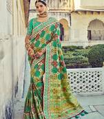   sea green embroidered silk saree with blouse