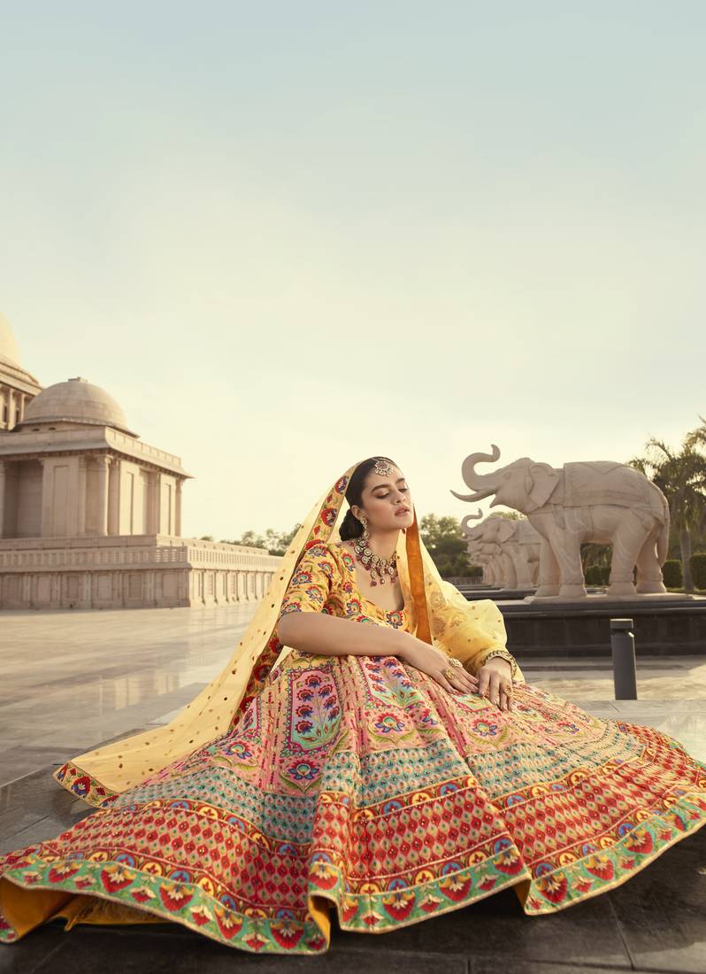 Shubhkala Yellow And Multicolored Embroiderey Work With Print With Diamond Work Art Silk Wedding Lehenga