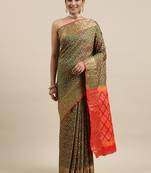 Green woven banarasi silk saree with blouse