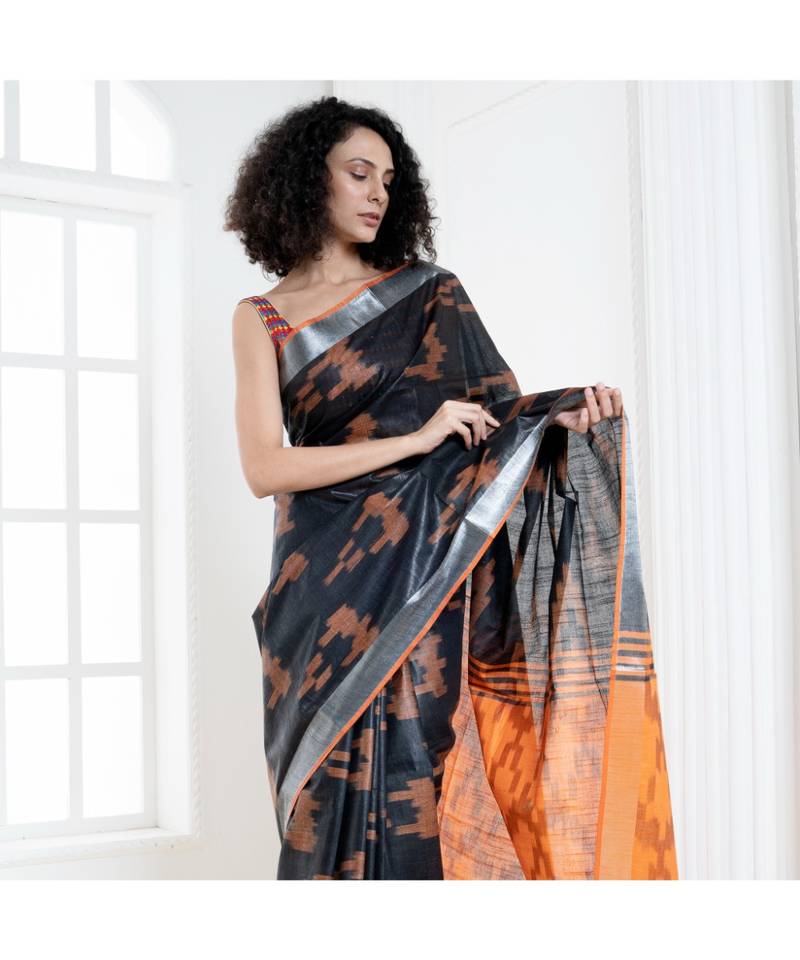Black blended cotton ikkat saree with orange motifs and pallu