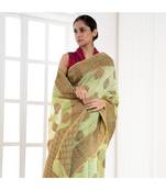 Mint green banarasi organza silk saree with antique copper zari motifs and border